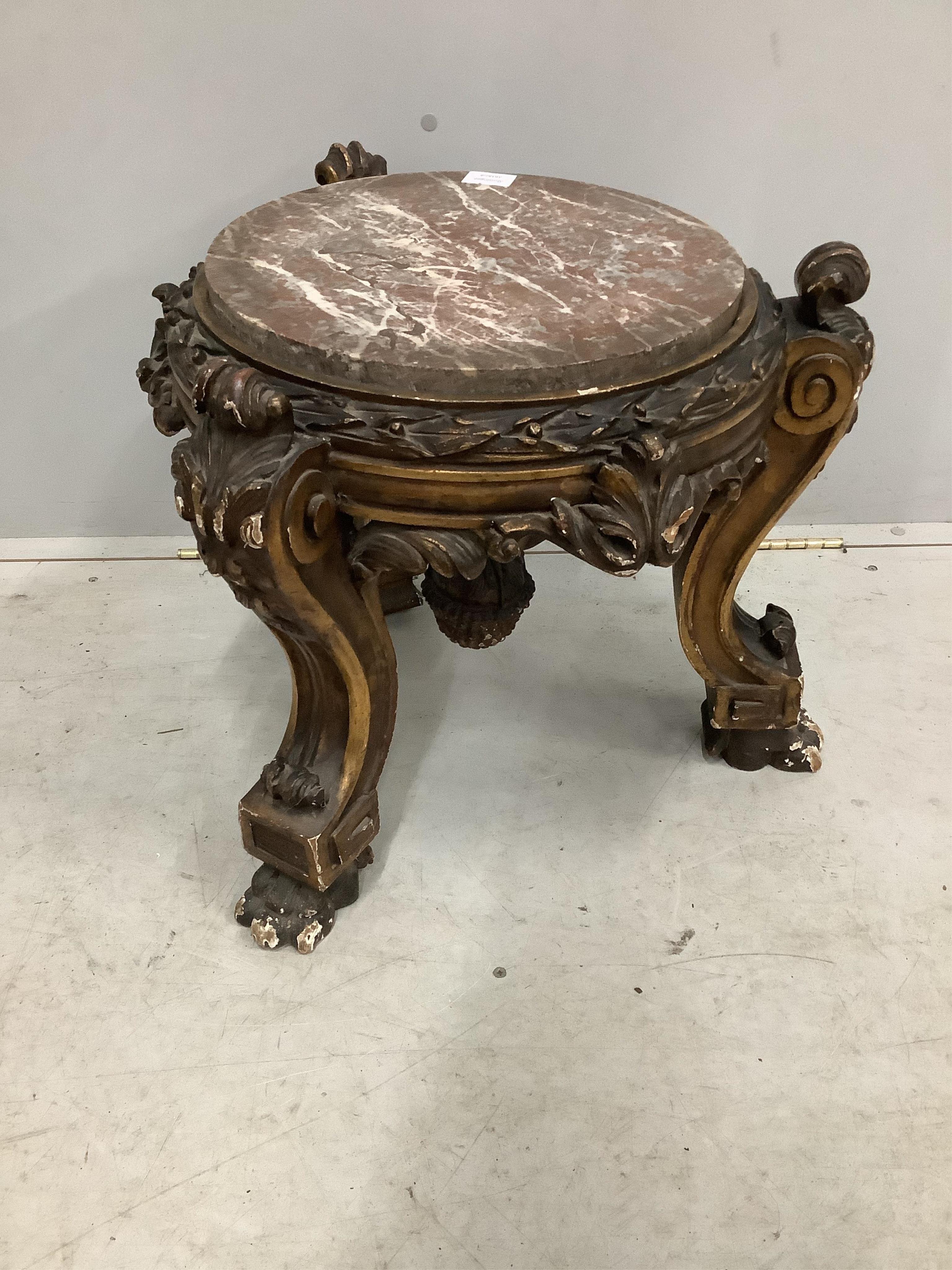 A 19th century carved parcel gilt and composition circular marble top low pedestal, diameter 54cm, height 47cm. Condition - fair to good